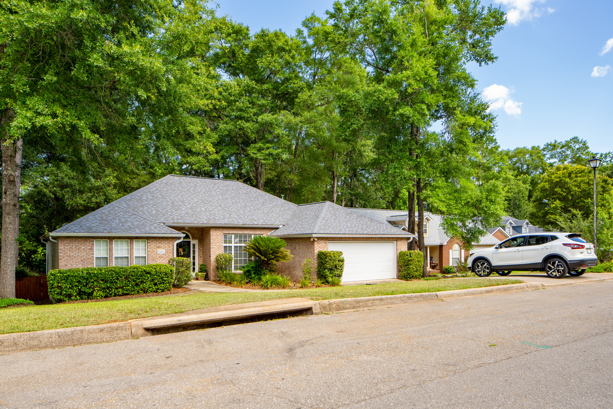 Single family home roof with asphalt shingles
