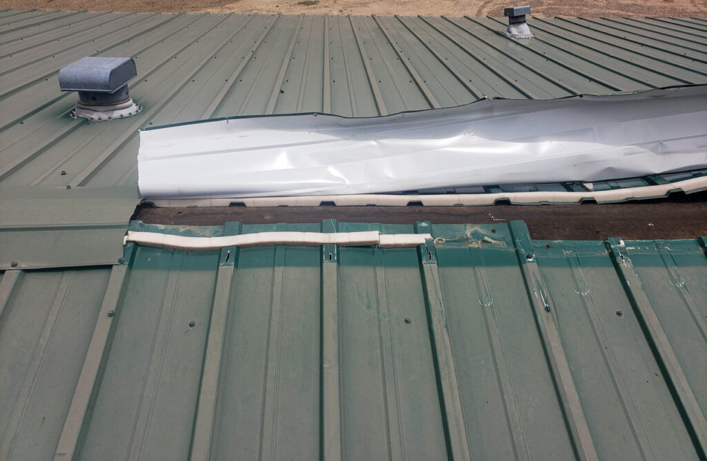 Lifted metal ridge cap, flashing, or drip edge