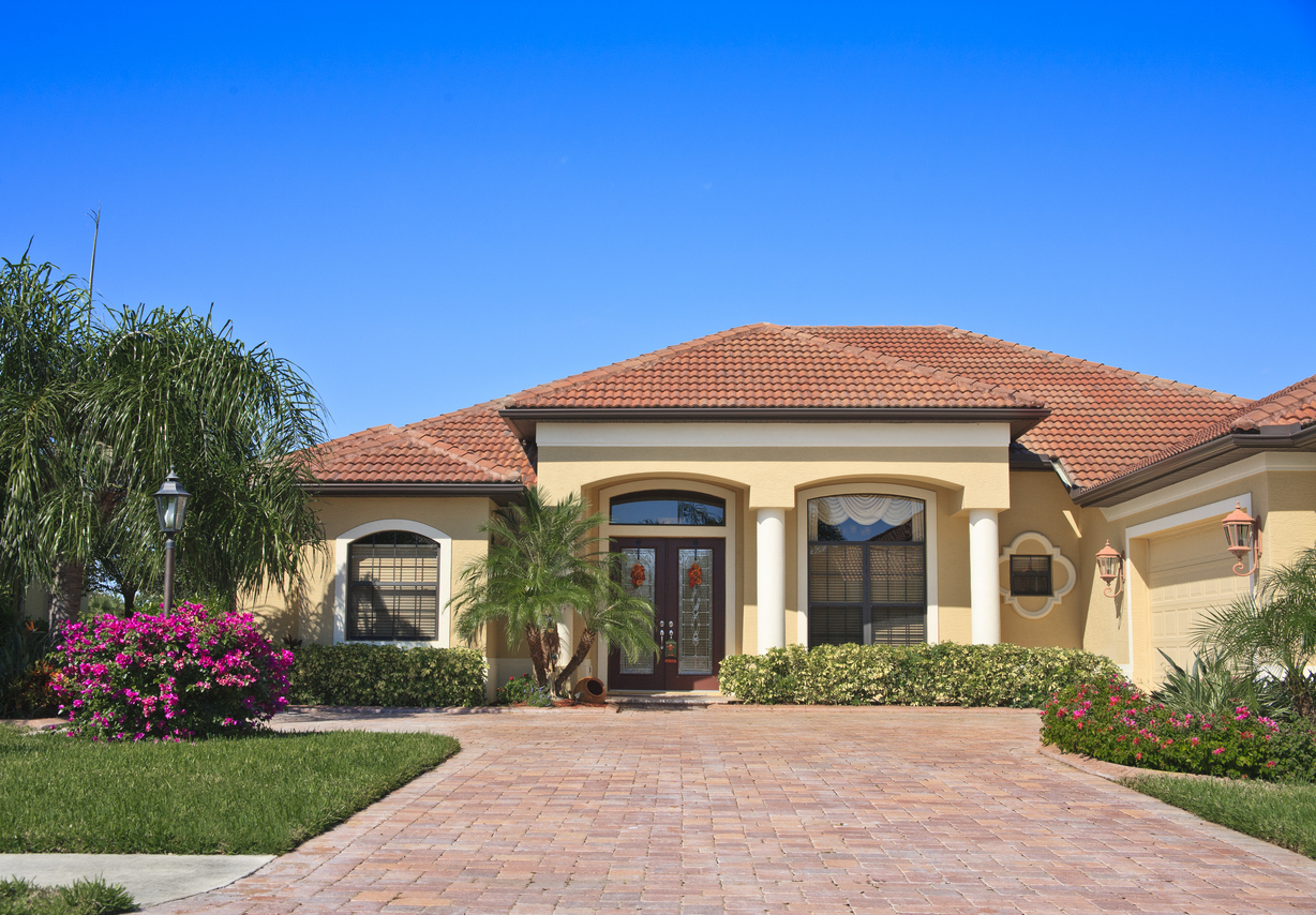 A modern home fitted with a clean tile roof