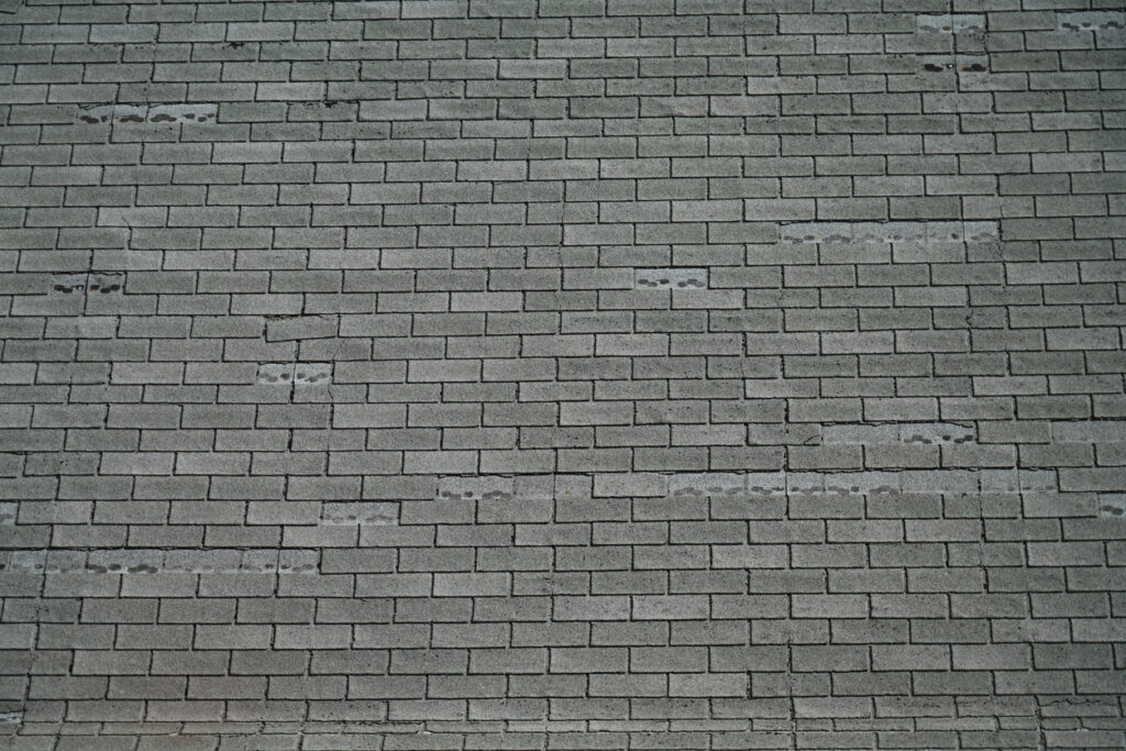 Curled, creased, torn, or broken shingles