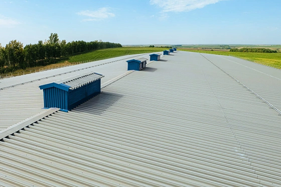 Metal panel roofing with ridge vents on a large commercial building