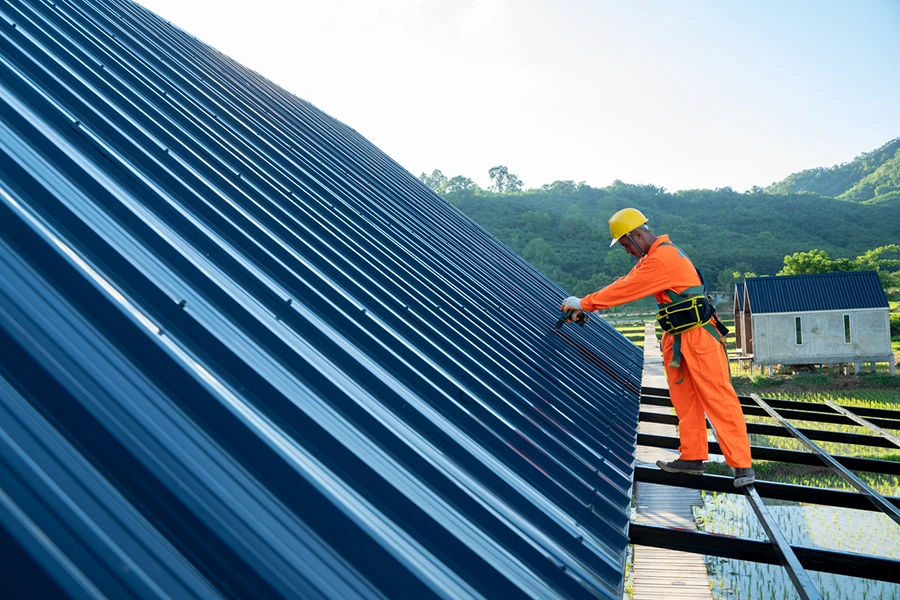 Standing seam metal roof panels running along a residential roofline