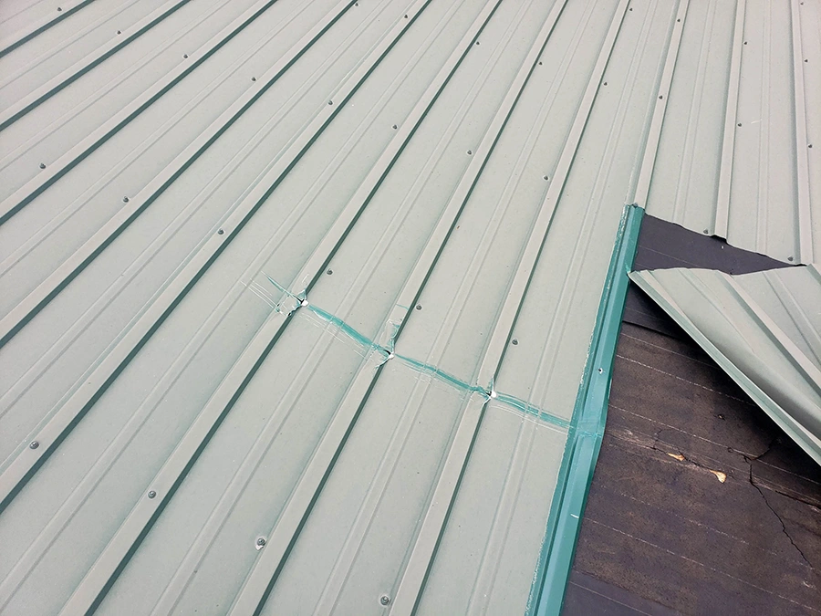 Metal roof damage after a storm
