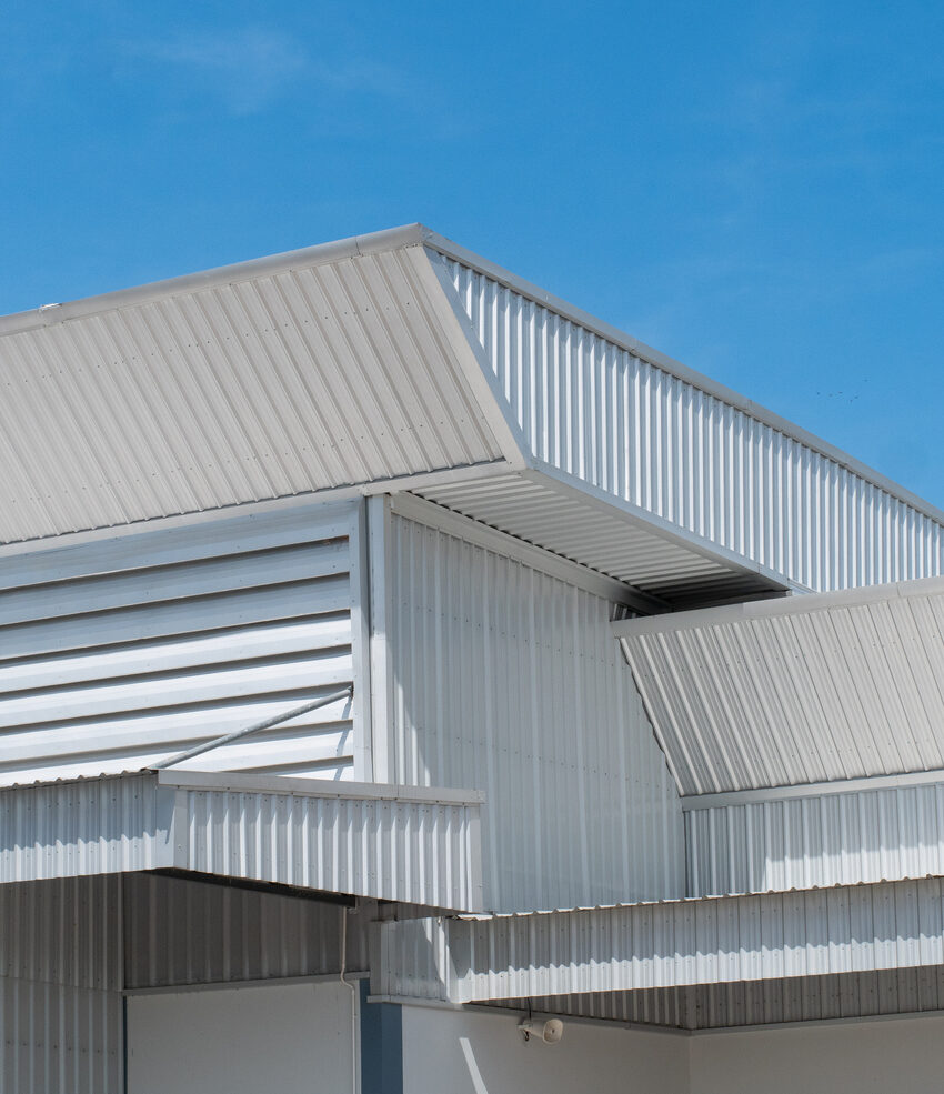 metal sheet roofing on commercial construction with blue sky