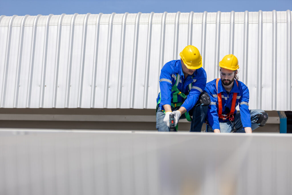 Engineer set installing and inspect standards of solar panels on roof of an industrial factory. Team technician inspection and repair technology solar cell. Alternative innovation power environmental.