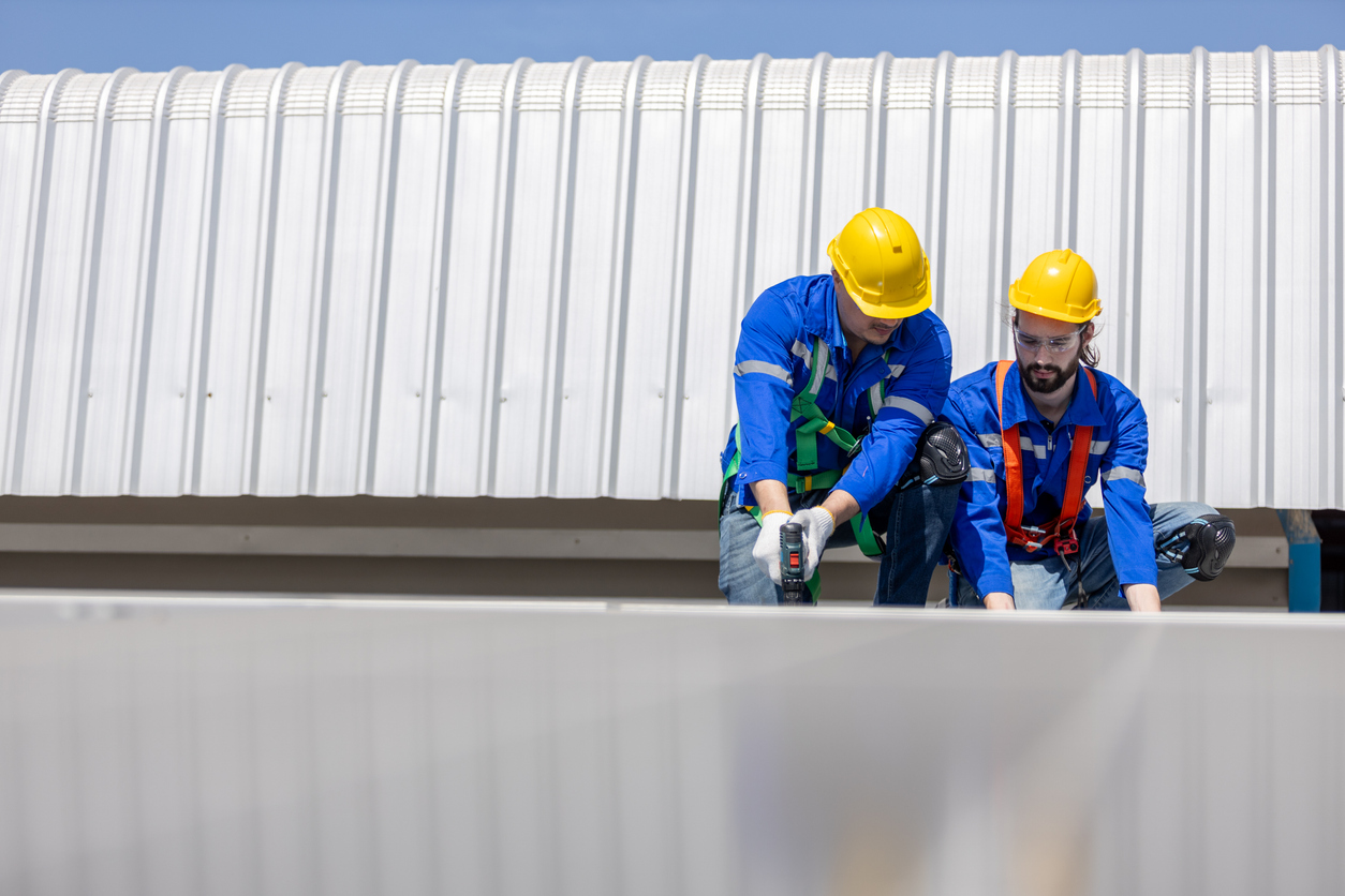 Engineer set installing and inspect standards of solar panels on roof of an industrial factory. Team technician inspection and repair technology solar cell. Alternative innovation power environmental.
