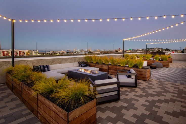 Beautiful house deck with cozy sofas and tables.